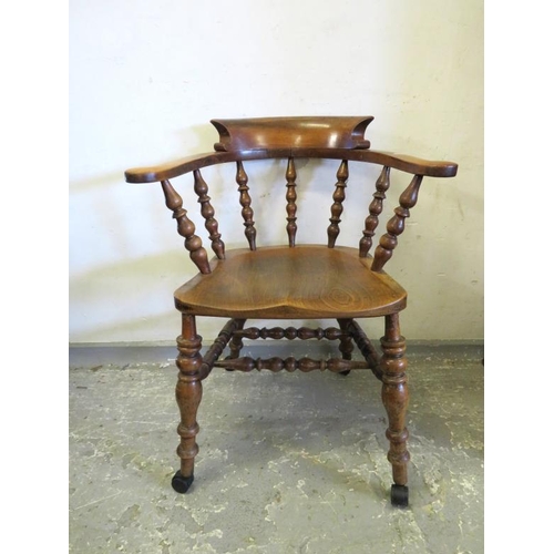 177 - Smoker's Bow Arm Chair with bobbin turned spindles on casters, approx. 51cm seat H (86cm total heigh... 