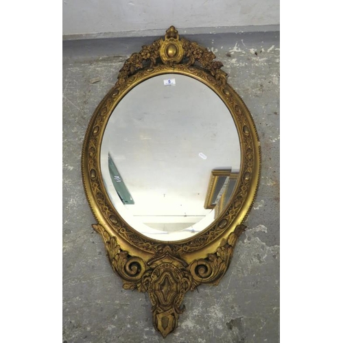 5 - Large Oval Gilt Framed Bevel Glass Wall Mirror decorated with flowers, cartouche, trailing leaves et... 