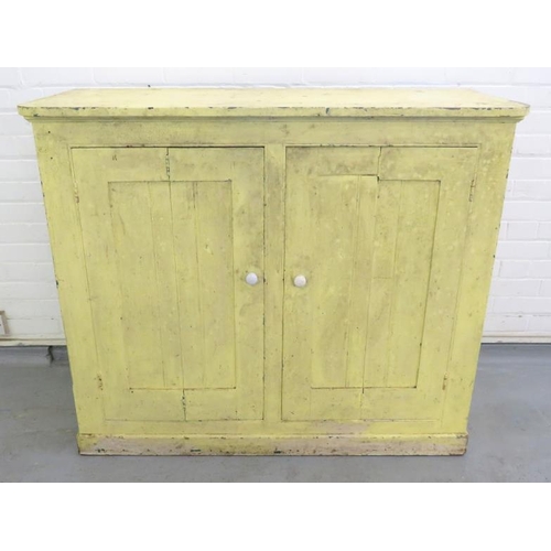 99 - Yellow Painted Pine Cabinet with bi-fold doors, plinth base approx. 127.5cm W x 57cm D x 106cm H