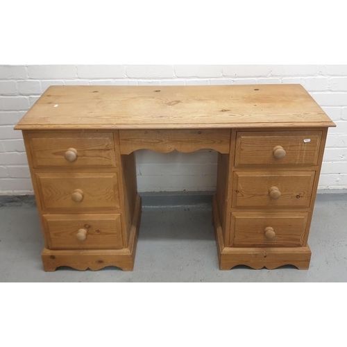 63 - Pine Desk/Dressing Table, 2 nests of 3 drawers, wavy plinth base, central drawer