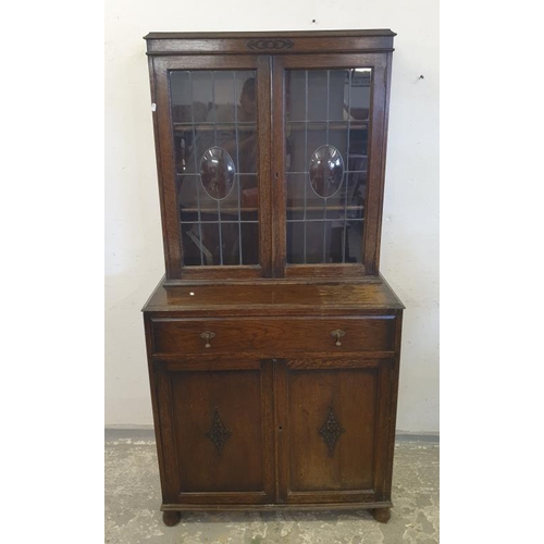 75 - Oak Cabinet Bookcase, concave lead panelled doors over single drawer, 2 door base (A5)