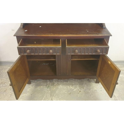124 - L Marcus Ltd Linen Fold Carved Oak Welsh Dresser, the base with 2 cupboard doors, 2 drawers over, su... 