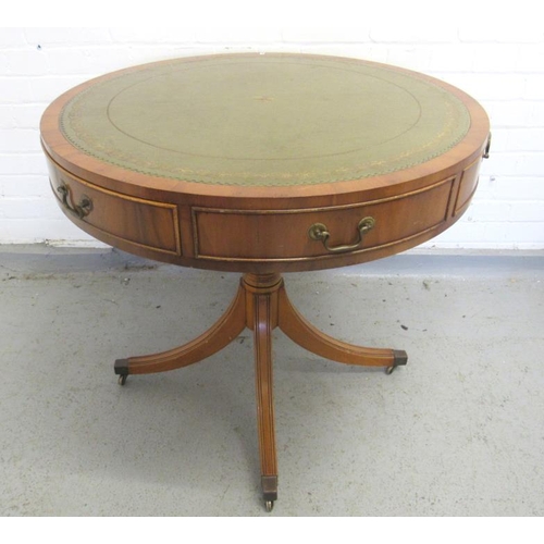 23 - Regency Style Yew Wood Circular Drum Table with green gilt tooled leather leather top, 4 faux drawer... 