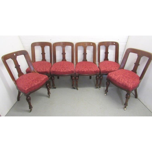 19 - Set of 6 Late C19th Victorian Chairs upholstered in red on castored supports, approx. 87cm H x 47cm ... 