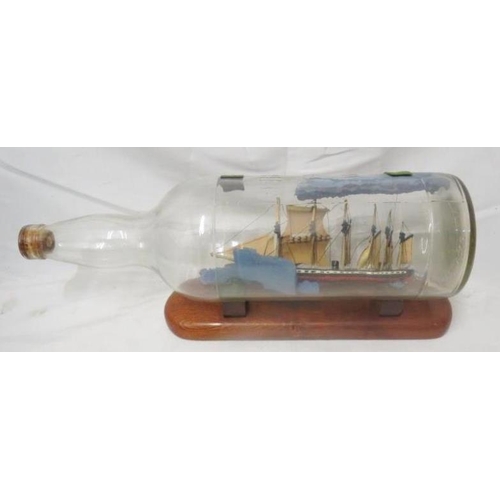 1588 - Wills Scotch Whisky Ship in a Bottle on wooden base approx.  50cm L