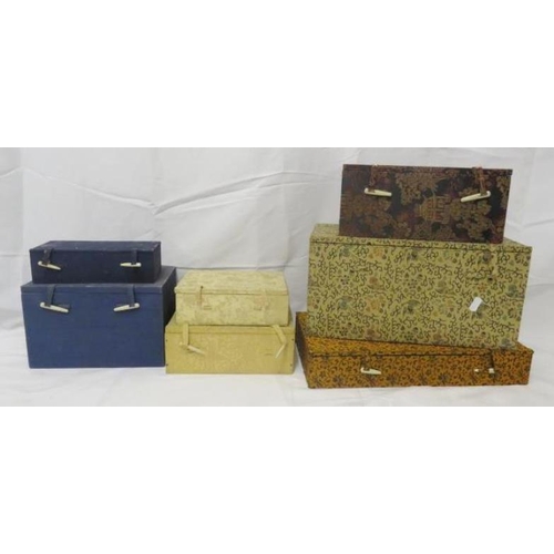 1584 - 7 Oriental Fabric Covered Boxes, ranging in size from 36cm x 18cm x 21cm to 20cm x 9.5cm x 6cm (7)