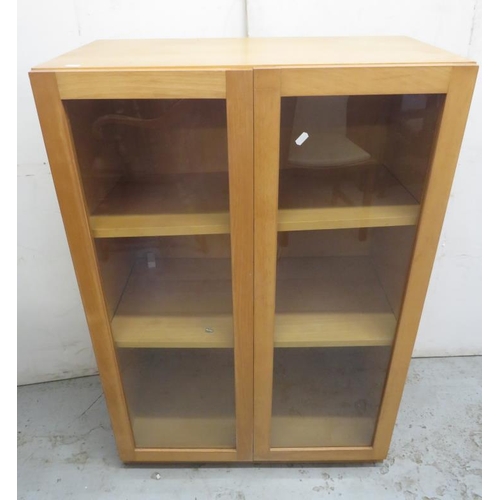 22 - Blonde Wood 2 Door Cabinet, 2 glazed doors with 2 internal shelves approx. 75cm W x 40cm D x 111cm H... 