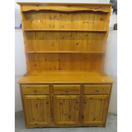 11 - Varnished Pine Dresser, 3 doors, 3 cupboards, plate rack over, base approx. 135cm W x 45cm D x 84cm ... 