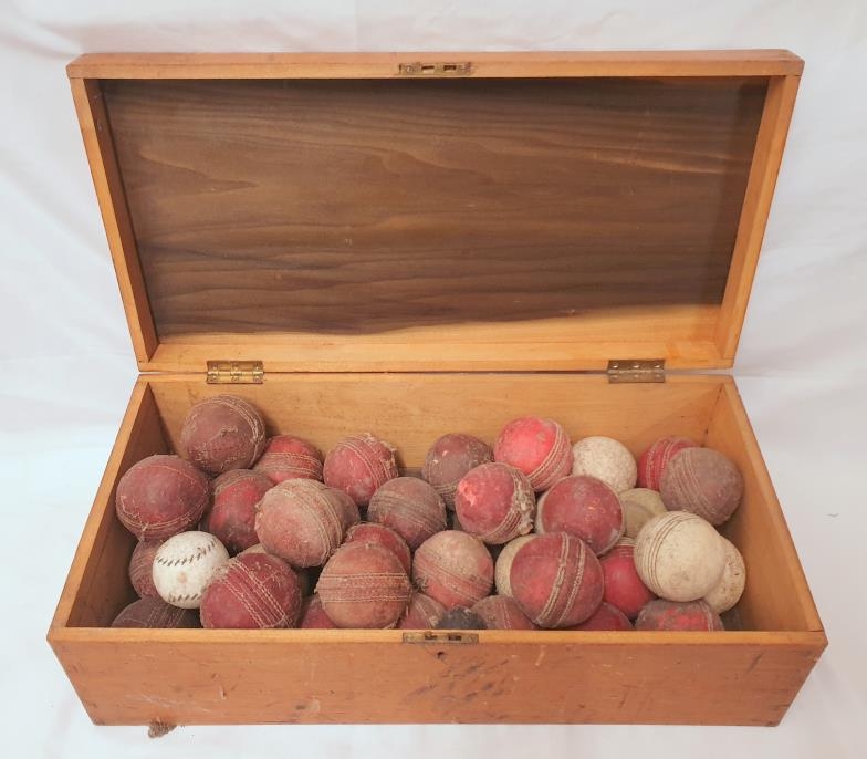 Wooden Box containing vintage cricket balls approx. 53cm x 28cm x 18cm