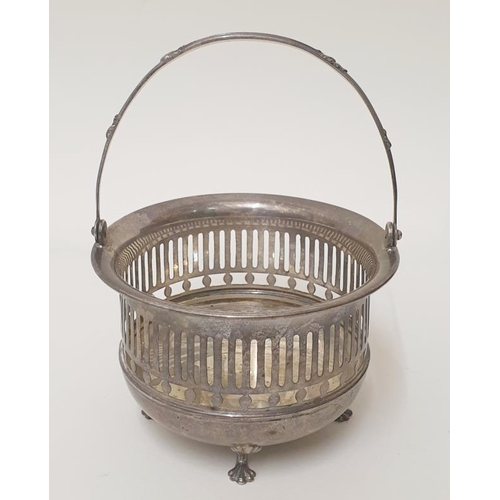 953 - Circular Pierced Sterling Basket with fold over handle, on paw supports approx. 6cm to rim, 9cm dia.