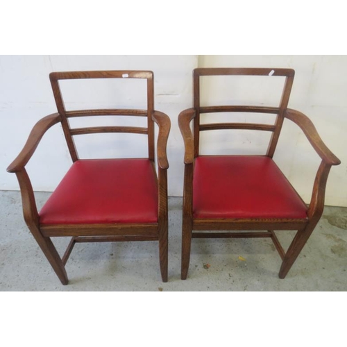 36 - Pair of Circa 1930's Oak Dining/Carver Chairs with railed backs, drop in red rexene seats approx. 57... 