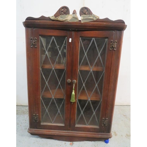 124 - Oak Corner Cabinet with lead light glazed doors, 2 shelves to interior, swan neck pediment over appr... 