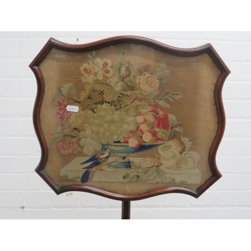 64 - Pole Screen with walnut disc base, inset with tapestry depicting still life fruit, flowers & bird ap... 