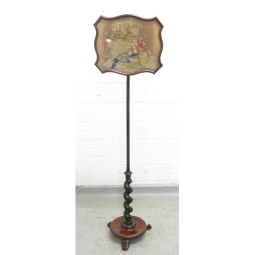 64 - Pole Screen with walnut disc base, inset with tapestry depicting still life fruit, flowers & bird ap... 