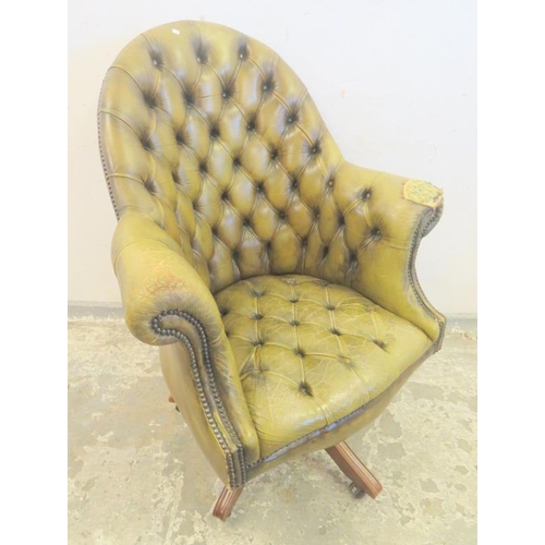 94 - Green Leather Deep Buttoned Backed Swivel Chair in need of restoration approx. 82cm W x 51cm D x 44c... 