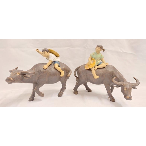 979 - 2 Shiwan Chinese Pottery Figures, children riding on water buffalo approx. 17cm H (2)