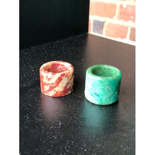 2 Chinese Hardstone Archers Rings, 1 jadeite & the other 'chicken blood ...