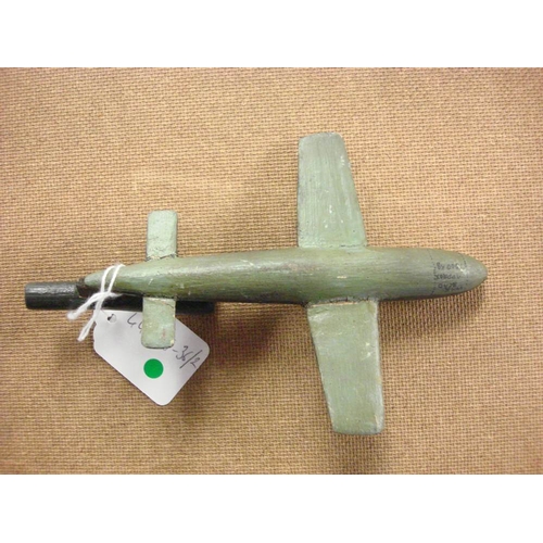 114 - A WWII period scratch built wooden model of a V1 'Doodle Bug': together with three RAF sweet heart b... 