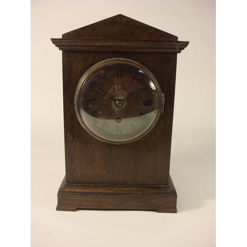 127 - A WWII RAF ward room mantel clock: the single fusee movement with Arabic numeral dial marked with RA... 