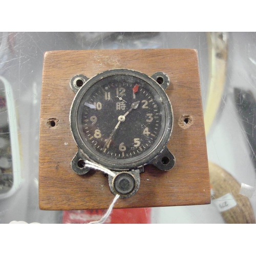 141 - A WWII Japanese Seikosha Model 100 aircraft clock: the black dial with luminous Arabic numerals and ... 