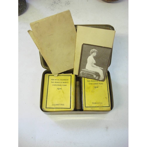 172A - A WWI Princess Mary 1914 Christmas tin: containing unopened tobacco, cigarette packet with ten cigar... 