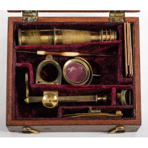 261 - An early 19th century lacquered brass field microscope, unsigned:, the 4 inch main tube on a rack an... 