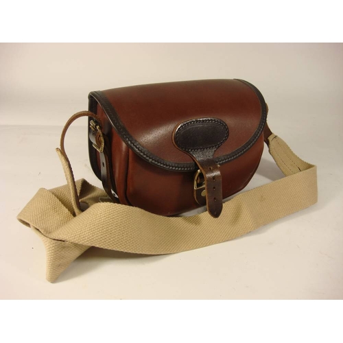 38 - A Parker-Hale leather cartridge bag:, 'CB 75-S' pattern.