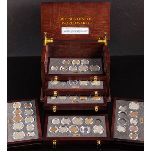 573 - A set of Danbury Mint 'British Coins of World War II' in a collectors cabinet.: