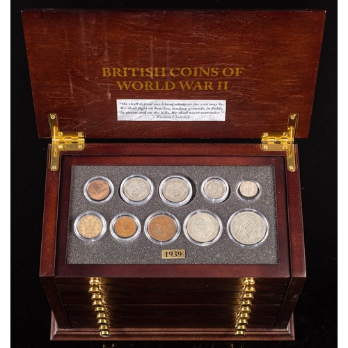 573 - A set of Danbury Mint 'British Coins of World War II' in a collectors cabinet.: