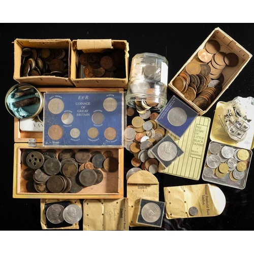 579 - A collection of tins and boxes containing world and English coins including some pre-1947 silver.: