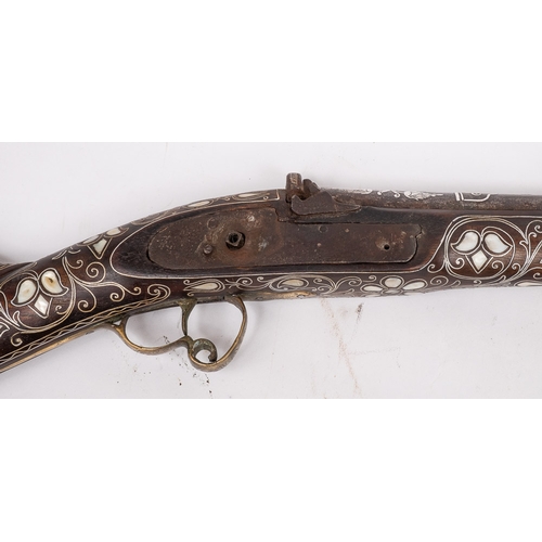 63 - A 19th century Turkish white metal and mother of pearl inlaid percussion cap rifle: the 35 inch  bar... 