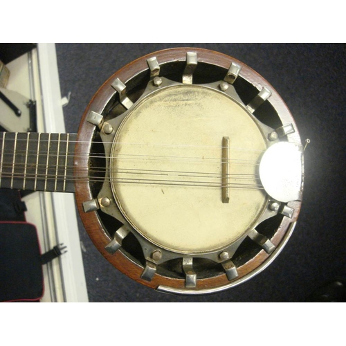 876 - An eight string 'Dulcetta' ukulele banjo by John Grey & Sons, London in case: together with a Keetch... 