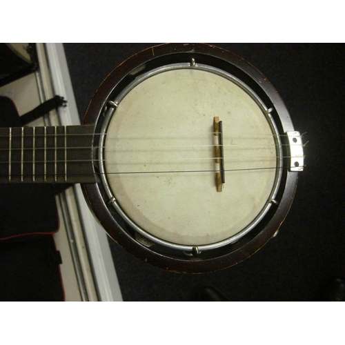 876 - An eight string 'Dulcetta' ukulele banjo by John Grey & Sons, London in case: together with a Keetch... 