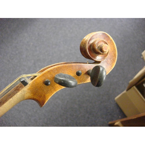 878 - A Czechoslovakian viola: scroll carved headstock over ebony finger board and body with two piece bac... 