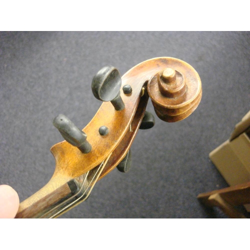 878 - A Czechoslovakian viola: scroll carved headstock over ebony finger board and body with two piece bac... 