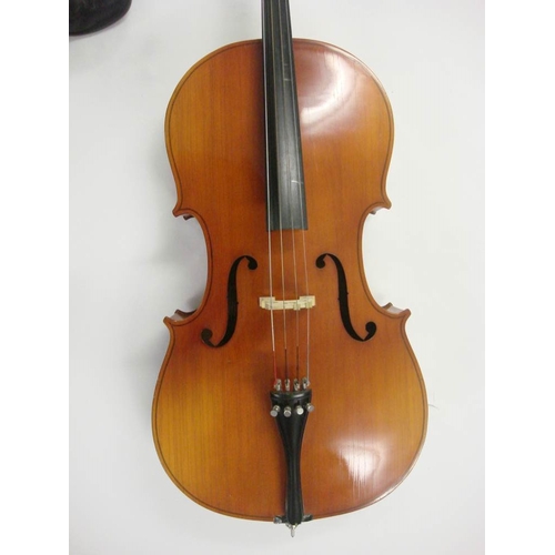 883 - A 20th century German cello:, scroll carved headstock with ebony keys and fingerboard, two piece fla... 