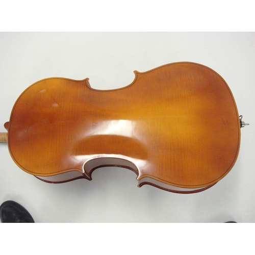 883 - A 20th century German cello:, scroll carved headstock with ebony keys and fingerboard, two piece fla... 