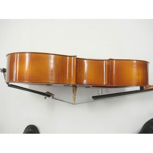 883 - A 20th century German cello:, scroll carved headstock with ebony keys and fingerboard, two piece fla... 