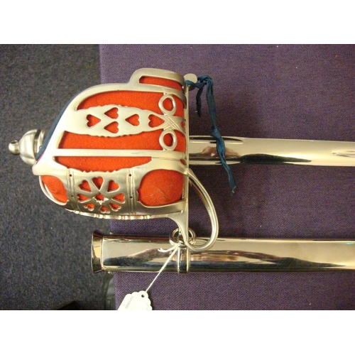 99 - An Elizabeth II Scottish broadsword: straight blade over basket hilt and pierce work guard, wire bou... 