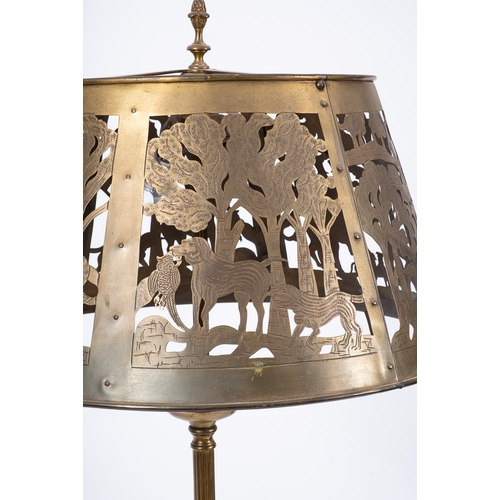 12 - An 20th century brass hunting theme standard lamp: the circular brass shade with piecework and stipp... 