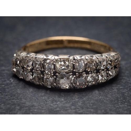 1111 - A diamond mounted two-row half-hoop ring: with graduated 'Peruzzi'-cut diamonds estimated to weigh a... 