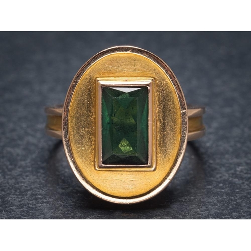 1117 - A green tourmaline mounted single-stone dress ring: with central rectangular green tourmaline, 9mm x... 
