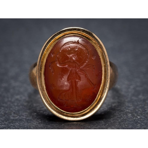1120 - A Roman cornelian intaglio mounted seal ring: the intaglio possibly depicting Ceres, the Roman godde... 