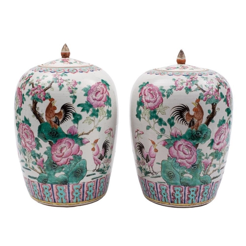 1153 - A pair of Chinese famille rose vases and covers for the Straits market: of oviform with lotus bud kn... 