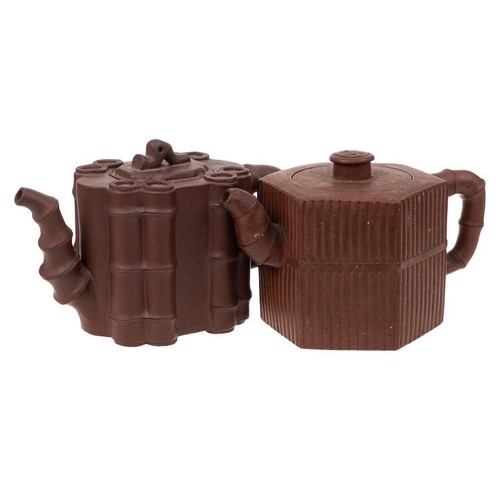 1168 - Two Chinese Yixing stoneware teapots: one of dark brown hue and with bamboo moulded decoration and b... 