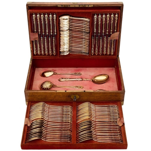 794 - A German silver gilt flatware service, stamped marks: crested, includes twenty four dessert forks, t... 
