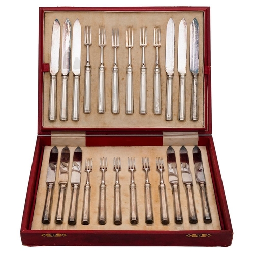 795 - A set of twelve George V silver handled dessert knives and twelve matching forks, maker Thomas Bradb... 