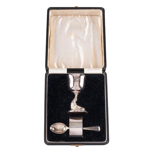 811 - A George VI silver three-piece christening set, maker Adie Brothers, Birmingham, 1938: the egg cup o... 