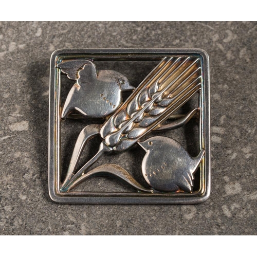 170 - Georg Jensen. A silver square brooch design number 250: depicting a pair of birds and wheatsheaf des... 