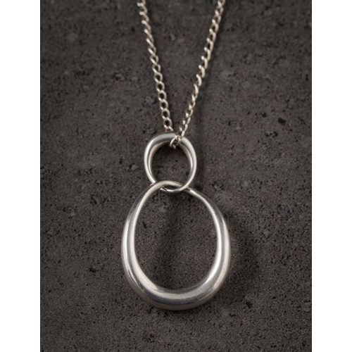 190 - Georg Jensen. A silver 'offspring' pendant design number 433: of two interlocking shapes symbolising... 